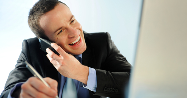 Cheerful man on a cell phone