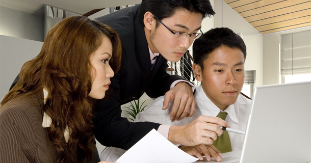 3 people analyzing data