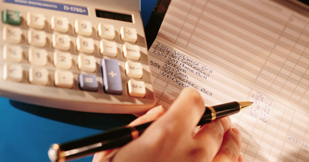 Calculator, pen and checkbook