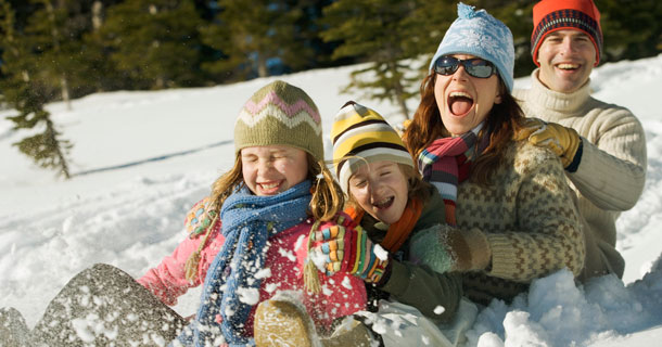 A Family sledding in the snow