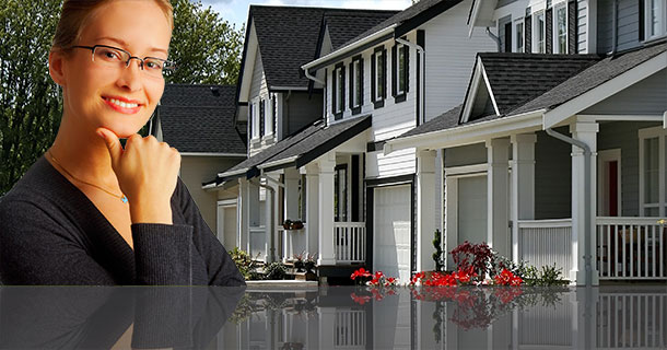 Female agent in front of houses