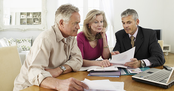 Agent showing paper to clients