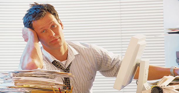 Man swamped in paperwork