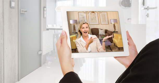 woman holding tablet with video